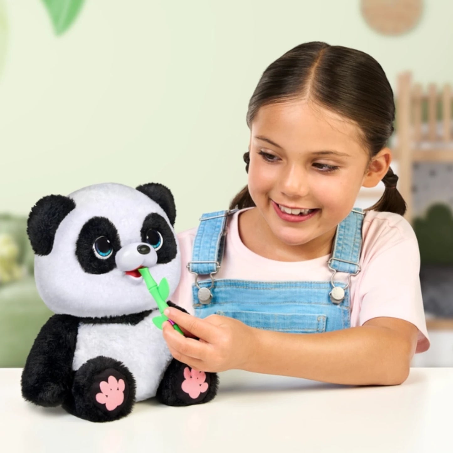Child playing with a Little Live Pets - My Baby Panda Chuchu plush panda toy indoors