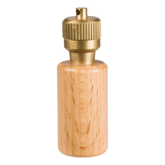 Wooden pepper grinder with brass top on a white background