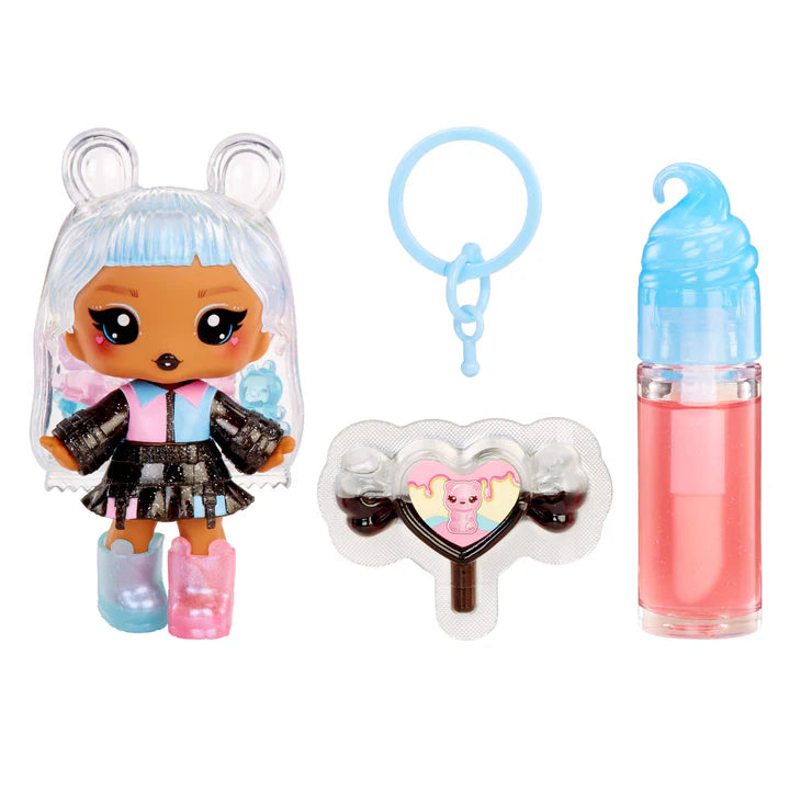 Toy figure with accessories including a keychain and lip gloss on a white background
