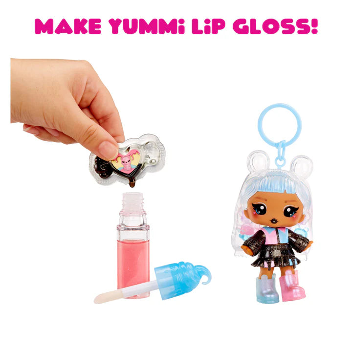 Make Yummi Lip Gloss set with doll, lip gloss, and applicator on a white background
