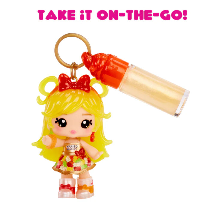 Keychain with a small doll figure and lip gloss, featuring the text 'Take it on-the-go!'.