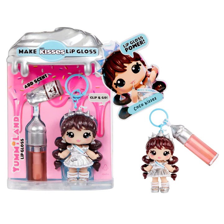 Yummiland x HERSHEY'S KISSES lip gloss doll with brown hair, wearing a silver dress and crown, shown with DIY lip gloss kit components including silver-topped lip gloss tube, scented liquid packet, stirring spoon, and keychain ring.