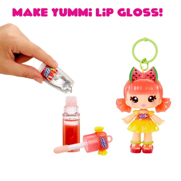 Make Yummi Lip Gloss toy set with a hand holding a small bottle, a keychain figure, and lip gloss applicator.