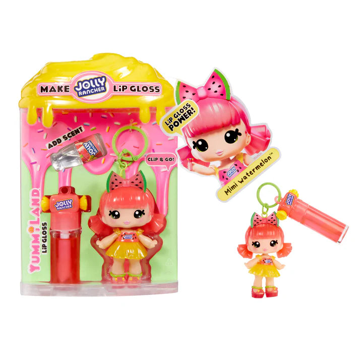 Yummiland x JOLLY RANCHER Watermelon lip gloss doll with pink hair and a watermelon bow, wearing a yellow dress, shown with DIY lip gloss kit components including pink lip gloss tube, scented liquid packet, stirring spoon, and keychain ring.