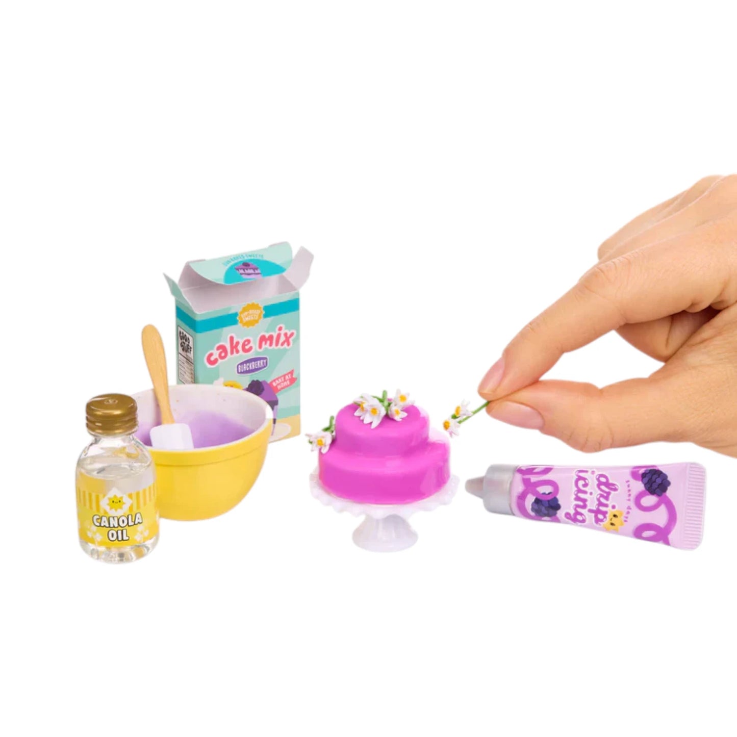 Miniverse Make It Mini From Scratch Series 2 Miniature baking set with cake, ingredients, and hand applying frosting on a white background