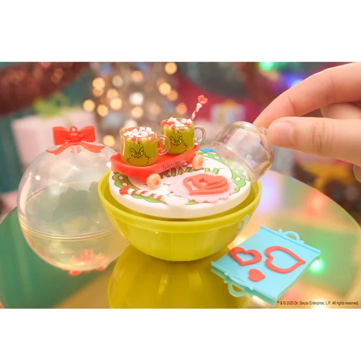 Miniverse Make It Mini Holiday Series 3 surprise capsuleclose up of ultra rare The Grinch Hot Cocoa pack.