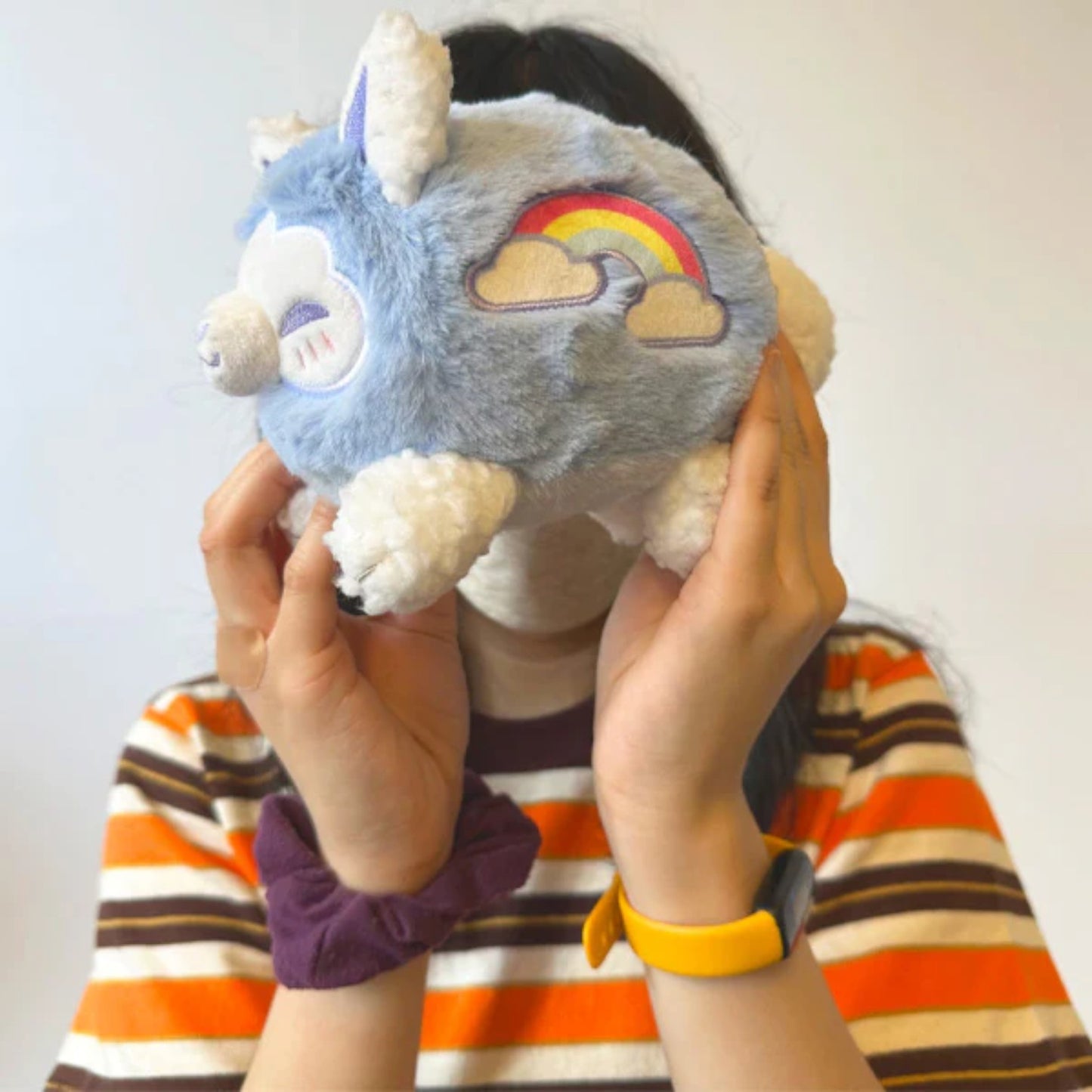Person Holding Squishable Cloudy Kitsune plush with pastel cloud markings