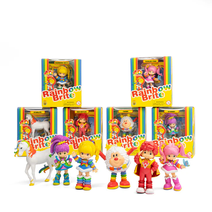 Collection of Rainbow Brite toys and packaging on a white background