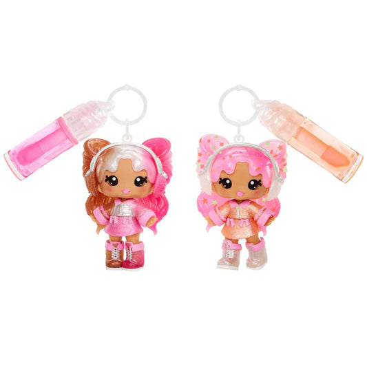 Two small figurines with pink hair and colorful outfits on a white background