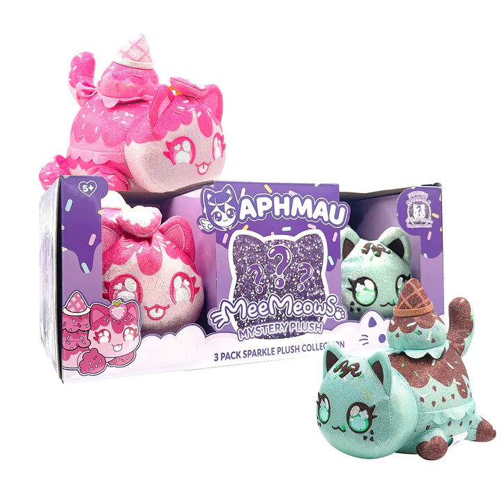 Packaging for Aphmau MeeMeows Sparkle Ice Cream 3 Pack Mystery Plush Collection, showing Sparkle Strawberry Cat, Sparkle Mint Chip Cat, and a purple glitter question mark indicating the mystery plush. Below are the plush toys outside the box.