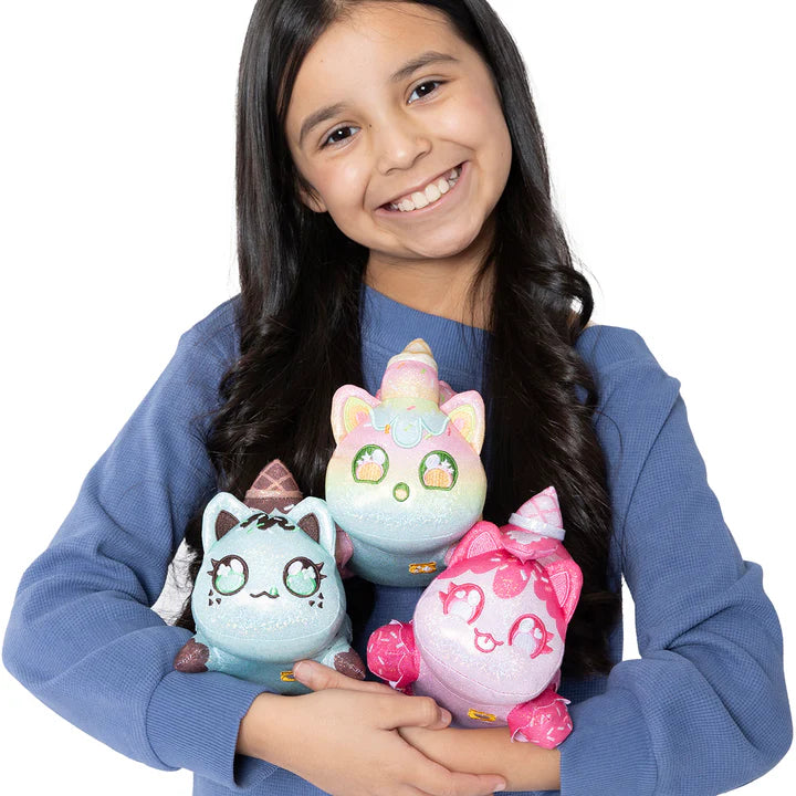 Girl holding Aphmau MeeMeows Sparkle Ice Cream 3 Pack Mystery Plush Collection