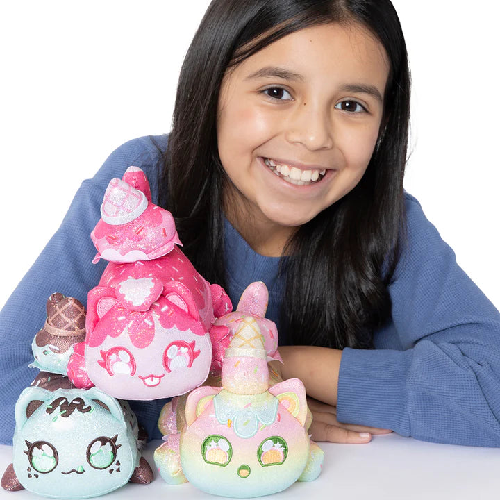 Girl holding Aphmau MeeMeows Sparkle Ice Cream 3 Pack Mystery Plush Collection