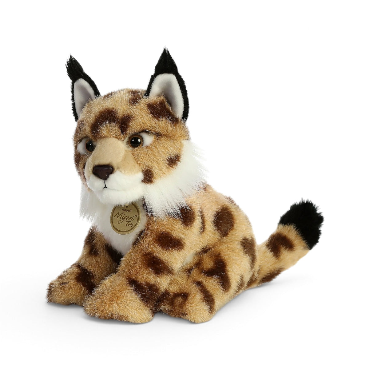 Aurora Miyoni Tots Lynx lifelike baby plush stuffed animal sitting with patterned spotted fur, pointed ears with black tufts, and a white chest.