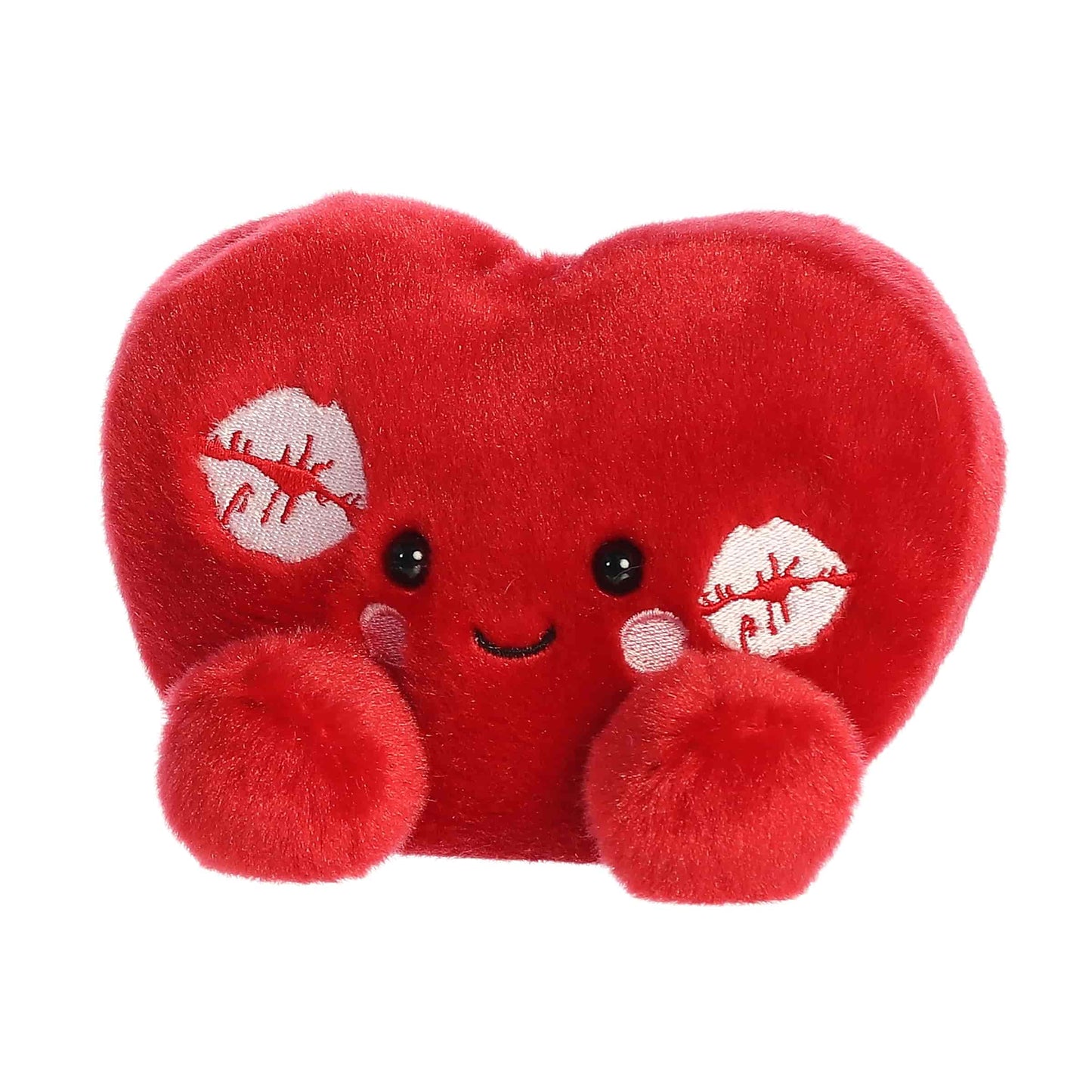 Angled view of Aurora Palm Pals Kimi Kisses Heart, a small 5-inch red plush.
