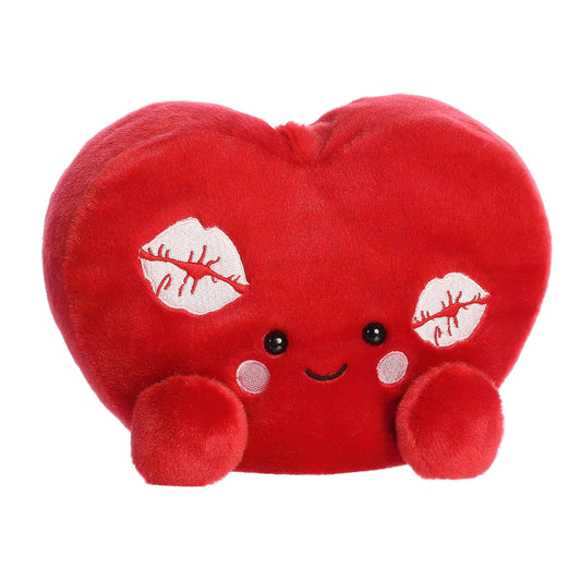Angled view of Aurora Party-Sized Palm Pals Kimi Kisses Heart, an 8-inch red plush heart.