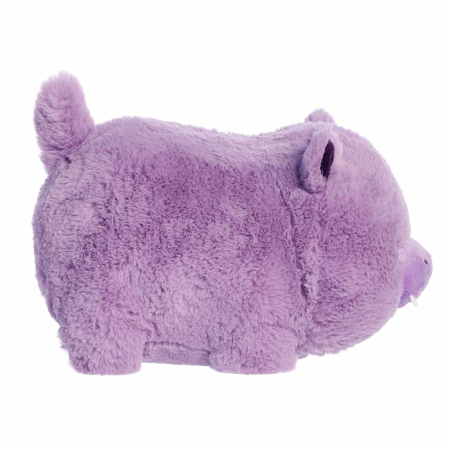 Side view of A product photo of the 10-inch Aurora Spudsters Harlo Hippo, a vibrant purple, potato-shaped plush with a friendly face and small tusks.
