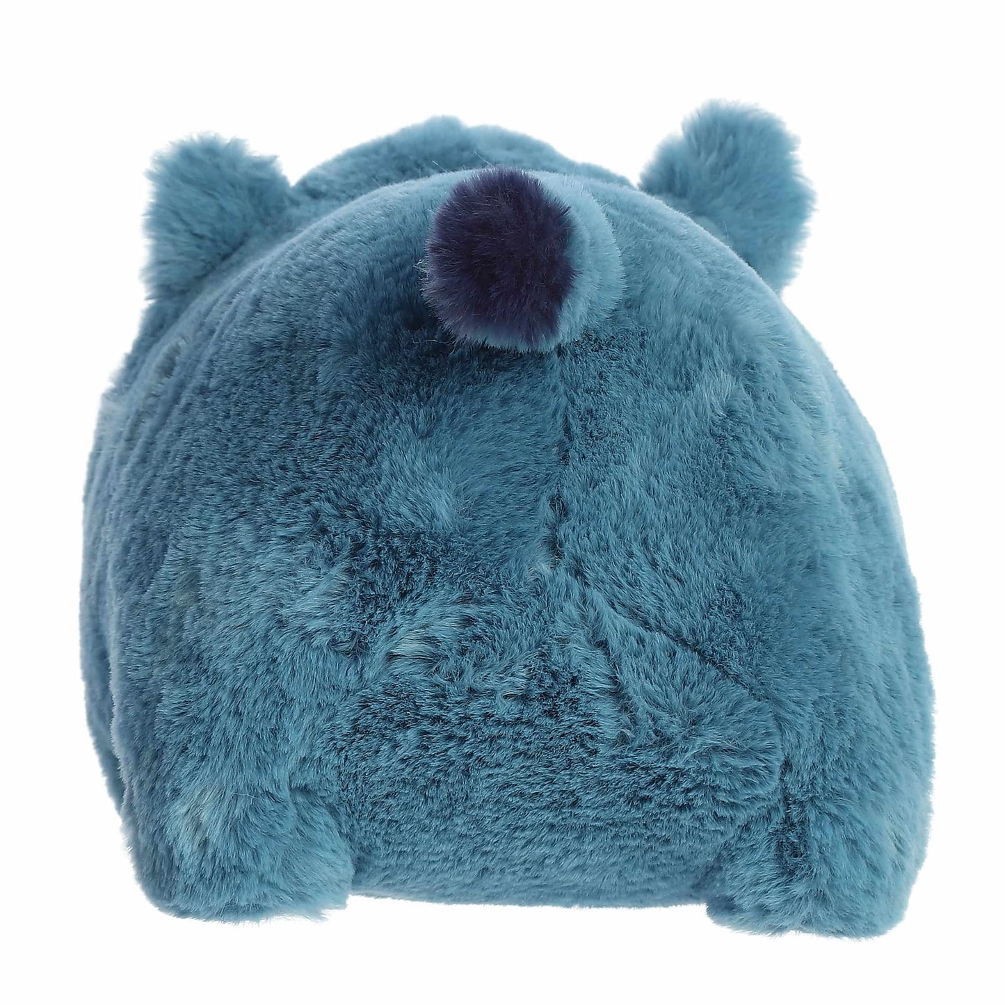 Back view of A product photo of the 10-inch Aurora Spudsters Rio Rhino, a bold blue, potato-shaped rhino plush with a small white horn.