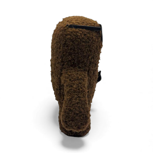 Side view of the 6.5-inch Domo plush dressed as a nerd, wearing thick black glasses with tape on the bridge and a black bow tie.