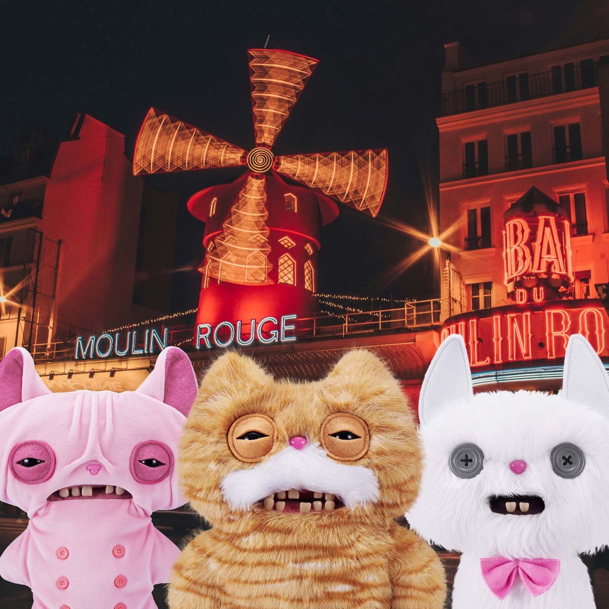 Three Fuggler Alley Cats in front of the Moulin Rouge at night.