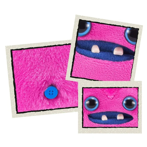Close up of A small, bright pink Fuggler Baby Fugg plush toy (Greedy Grinner) with large blue eyes, two white baby teeth showing in a blue mouth, and a spiky purple tuft of hair on top.