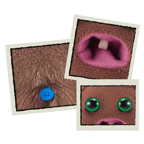 Close up of A small, roundish brown Fuggler Baby Fugg plush toy (Hedge Grog) with large green eyes, two white baby teeth showing in a pink mouth, and a spiky brown tuft of hair on top.