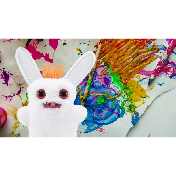 White plush toy with red eyes on a colorful painting background