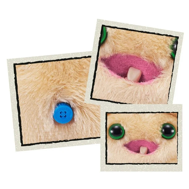 Close-up of A small, yellowish-beige Fuggler Baby Fugg plush toy (Screech) with large green eyes, one white baby tooth showing in a pink mouth, and a spiky brown tuft of hair on top.