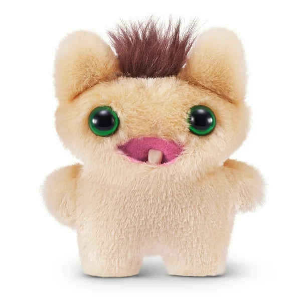 A small, yellowish-beige Fuggler Baby Fugg plush toy (Screech) with large green eyes, one white baby tooth showing in a pink mouth, and a spiky brown tuft of hair on top.