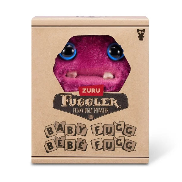 Display box of A small, reddish-pink Fuggler Baby Fugg plush toy (Sir Belch) with large blue eyes, two white baby teeth showing, and a bright pink tuft of hair on top.