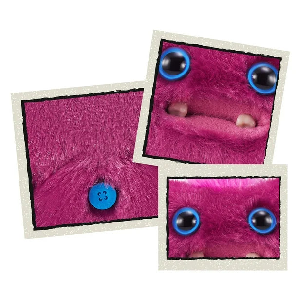 Close up of A small, reddish-pink Fuggler Baby Fugg plush toy (Sir Belch) with large blue eyes, two white baby teeth showing, and a bright pink tuft of hair on top.