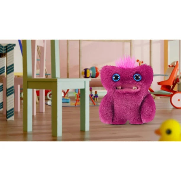 Pink plush toy with blue eyes in a playroom setting