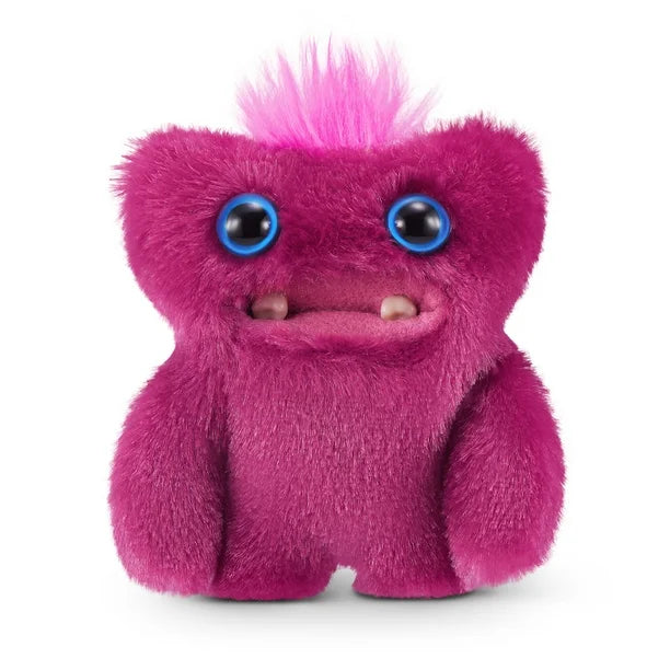 A small, reddish-pink Fuggler Baby Fugg plush toy (Sir Belch) with large blue eyes, two white baby teeth showing, and a bright pink tuft of hair on top.