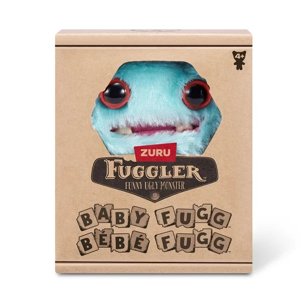 Display Box of A small, teal Fuggler Baby Fugg plush toy (Wide Eyed Weirdo) with large red eyes, two white baby teeth showing in a pink mouth, and a spiky pink tuft of hair on top.