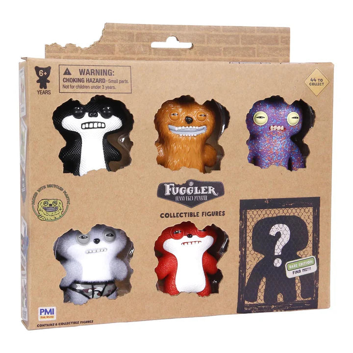 Packaging of Fuggler collectible figures with various characters on a cardboard background.