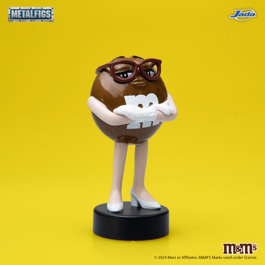 Jada Toys M&M's Brown Character 2.5-inch Metalfigs die-cast figure mounted on a black display pedestal.