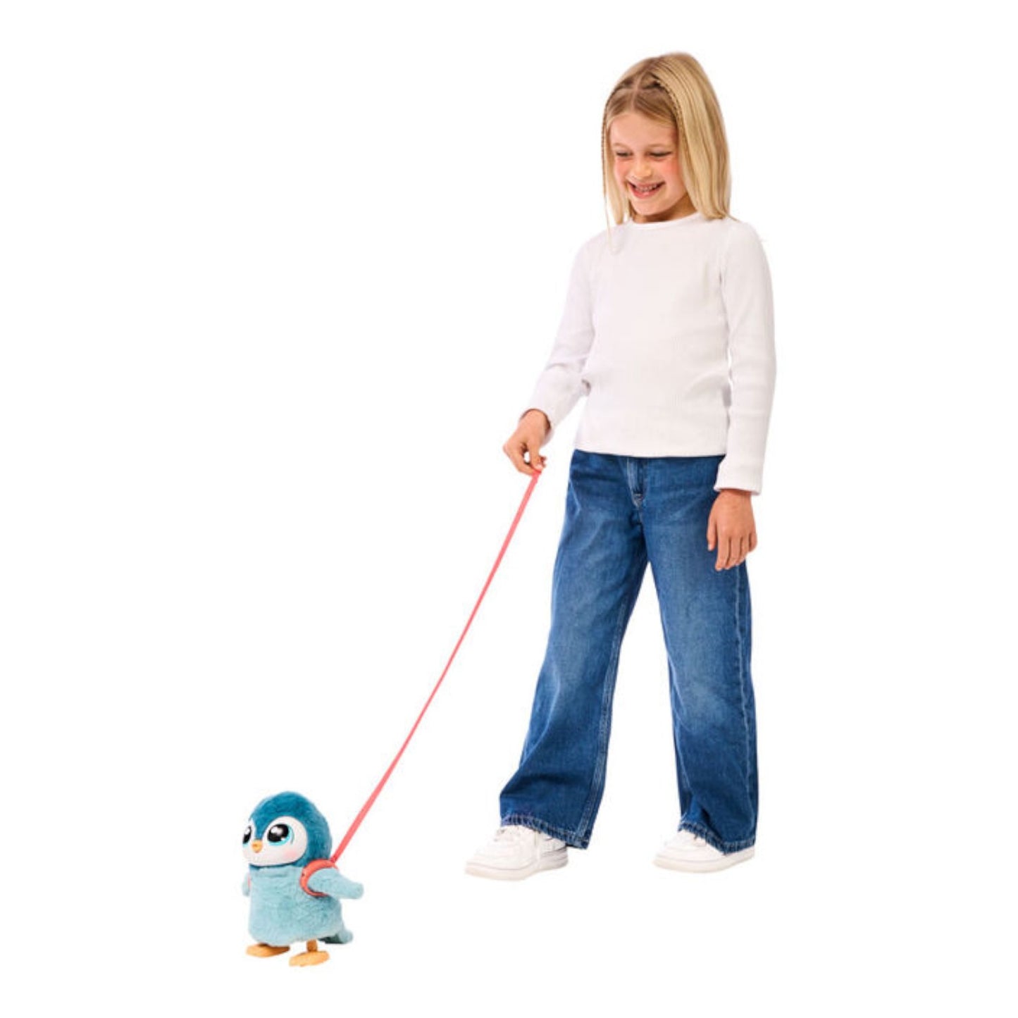 Child holding a Little Live Pets My Walking Penguin on a leash against a white background