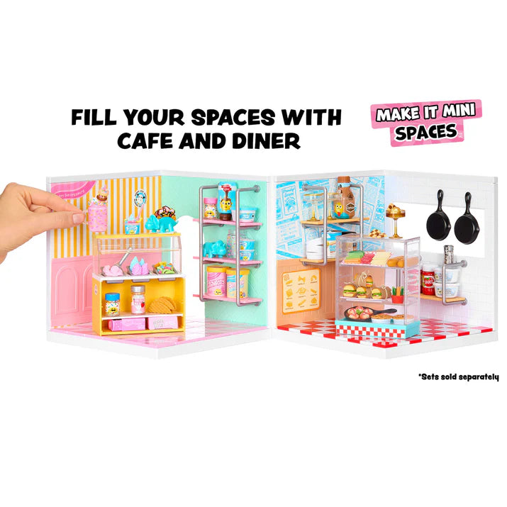 Miniature cafe and diner set with a hand holding it open, showing various items inside.