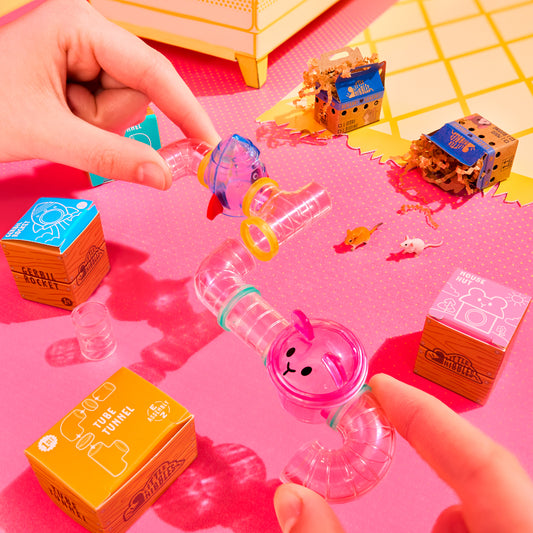 MGA's Miniverse Make It Mini Animals Series 2 surprise capsule and crafted miniature mouse with a rocket ship tube habitat.