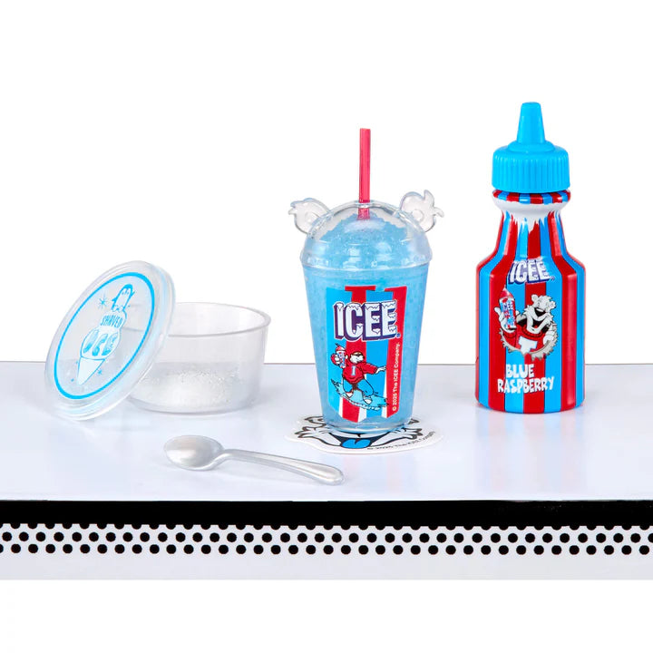 A completed miniature Blue Raspberry Icee replica with a bear-ear lid and straw, sitting next to a branded syrup bottle and a container of faux shaved ice.