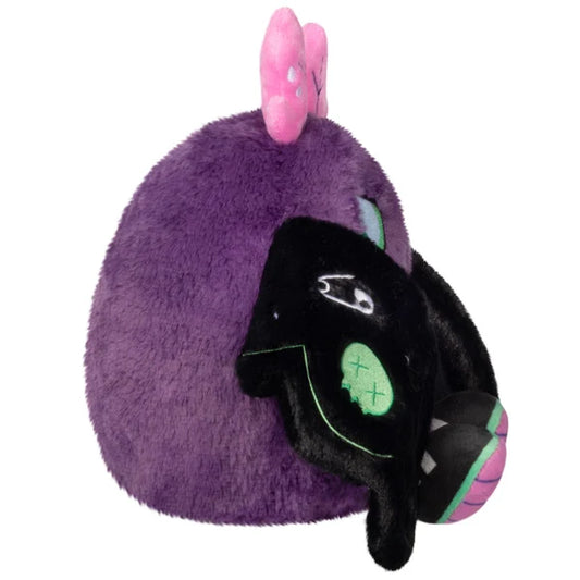 Mini Squishable Neon Punk Mothman plush with deep purple fur, neon pink antennae, bright green eyes, and patch-embellished black wings.