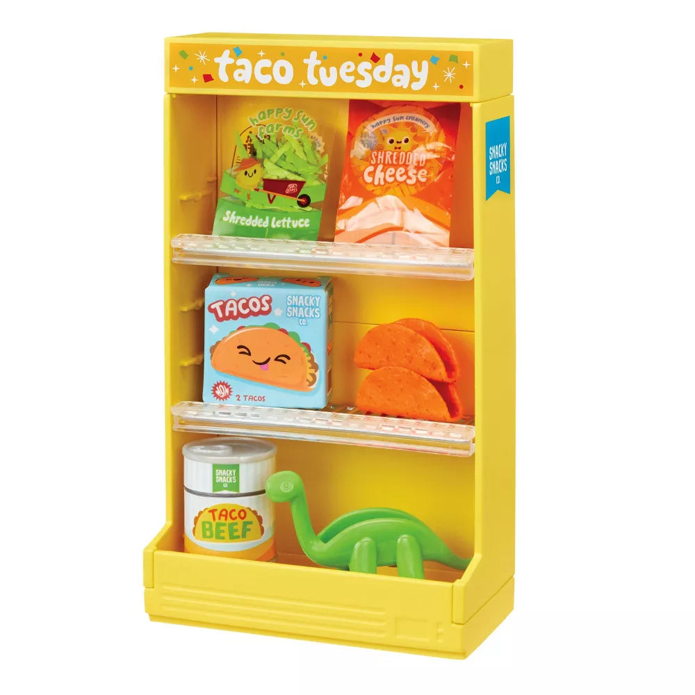 Miniverse Make It Mini Spaces Furniture Yellow toy taco stand with various taco-themed items on a white background