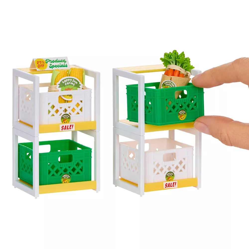 Miniverse Make It Mini Spaces Furniture Miniature grocery store shelf with crates and a hand placing a toy burger on top.