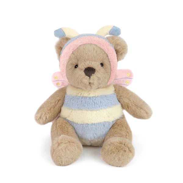 A light brown teddy bear plush sitting down, wearing a pastel blue, pink, and cream striped butterfly costume with pink wings and a hood featuring blue and cream antennae