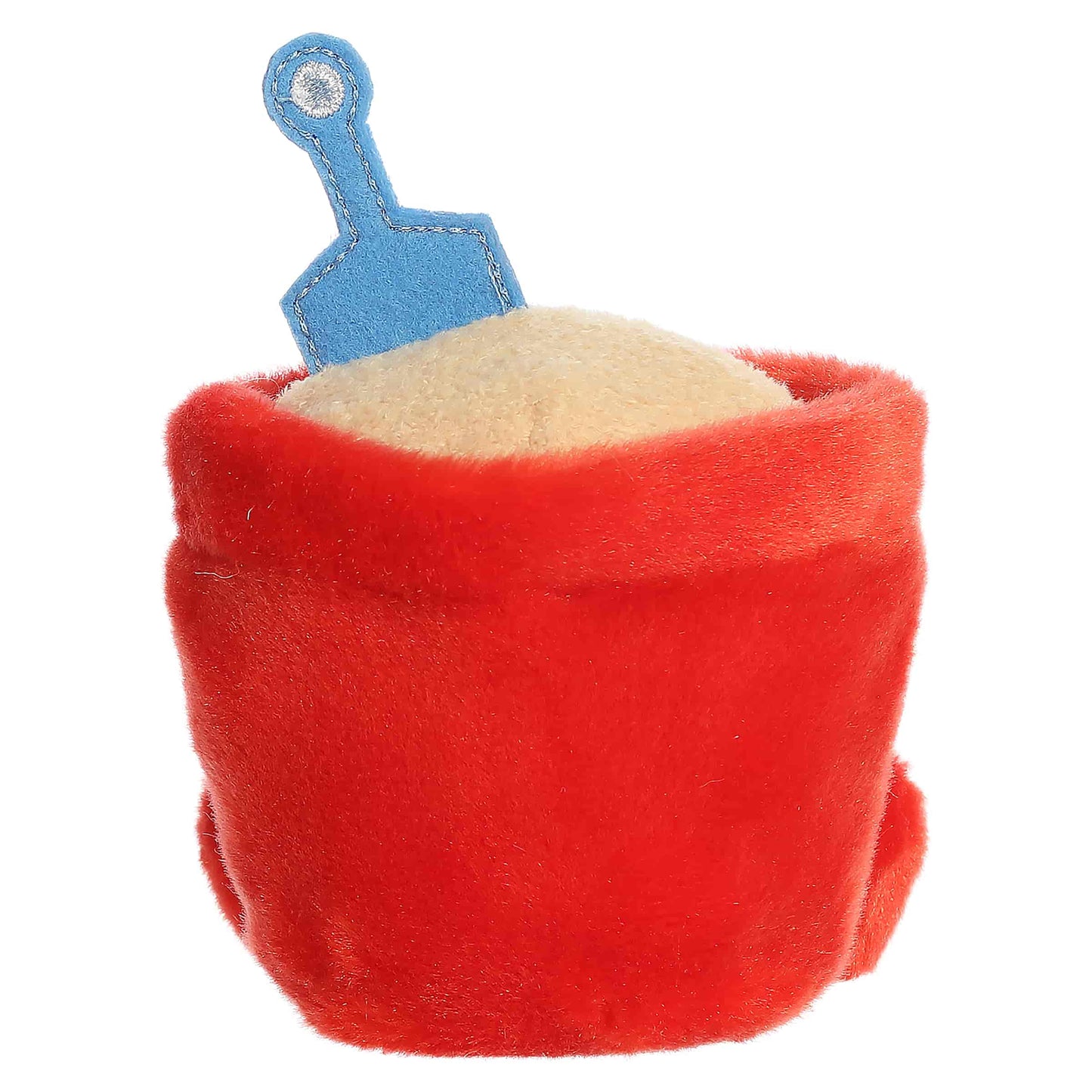 Palm Pals June Sand Bucket, a small red plush shaped like a beach bucket filled with sand and a blue shovel, featuring a sweet smiling face.
