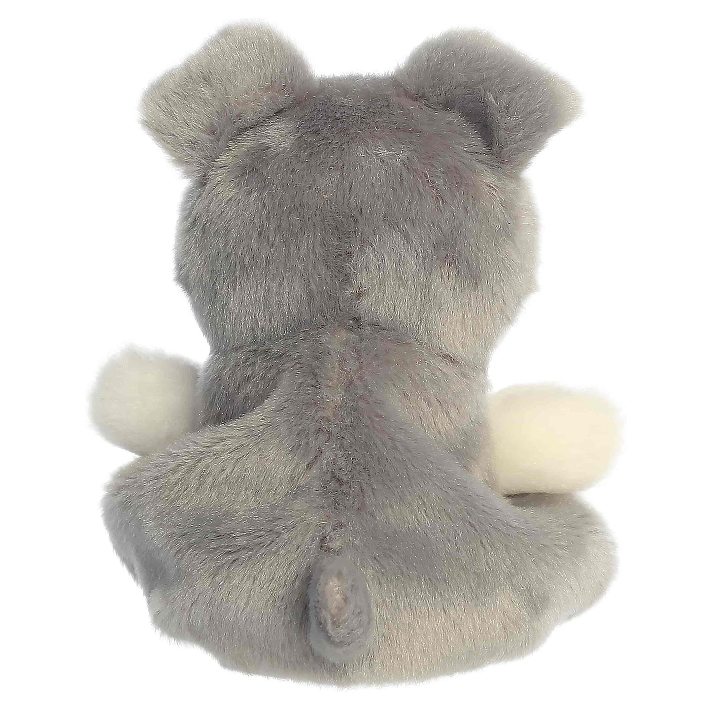 Palm Pals Korra Schnauzer, a small gray and white plush dog with a fluffy muzzle and tiny folded ears.