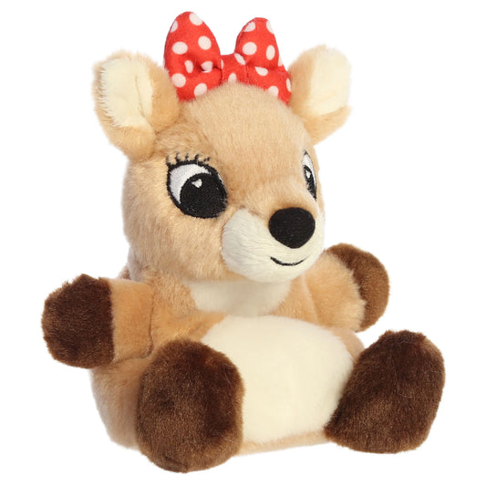 Palm Pals Clarice character plush toy from Rudolph the Red-Nosed Reindeer sitting down with a red polka dot bow.