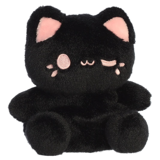 Palm Pals Tasty Peach Strawberry Black Out Meowchi plush toy with a soft black body, playful pink inner ears, and a winking embroidered smile