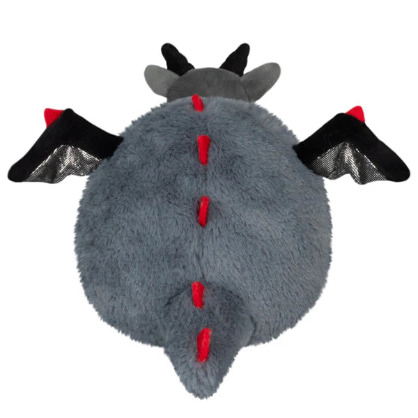 Gray plush toy with black wings and red accents on a white background