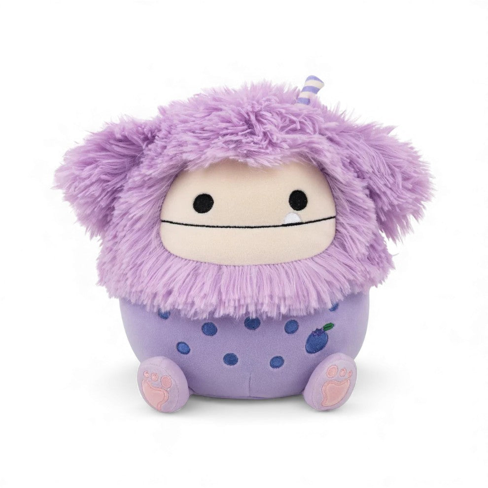 A product photo of Dikka the Boba Tea Bigfoot, a small purple Squishmallows plush with long, fluffy lavender hair and a boba tea body, sitting on a white background.