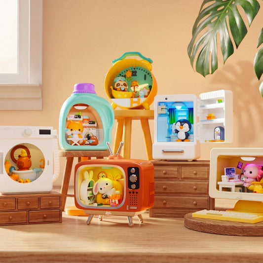 Toy kitchen set with various appliances and a penguin on a screen.